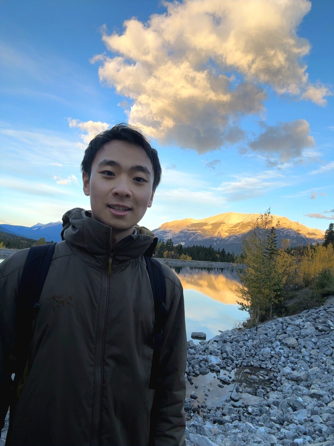 Jeremy by a mountain lake at sunset